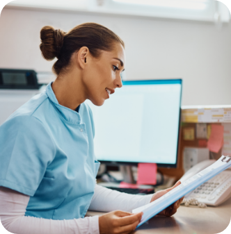 young-nurse-going-through-medical-records-at-recep-2022-12-06-00-59-06-utc